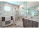 Elegant bathroom featuring marble walls and a spacious shower at 12113 Marblehead Dr, Tampa, FL 33626