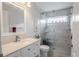 Updated bathroom with a walk-in shower, built-in shelving and modern vanity at 12113 Marblehead Dr, Tampa, FL 33626