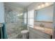 Clean bathroom with granite countertop and a walk-in shower at 12113 Marblehead Dr, Tampa, FL 33626