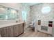 Modern bathroom with marble, double vanity and a separate toilet area at 12113 Marblehead Dr, Tampa, FL 33626
