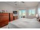 Bright bedroom with sliding doors leading to the pool area at 12113 Marblehead Dr, Tampa, FL 33626
