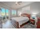 Spacious main bedroom with wood flooring and access to the pool area at 12113 Marblehead Dr, Tampa, FL 33626
