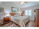 Comfortable bedroom with a wood bed frame and wood floors at 12113 Marblehead Dr, Tampa, FL 33626