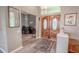 Bright and airy entryway with wood floors and views to an office at 12113 Marblehead Dr, Tampa, FL 33626