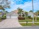 Two-story house with tile roof, two-car garage, and landscaped yard at 12113 Marblehead Dr, Tampa, FL 33626