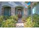 Elegant double front doors with stone columns and landscaping at 12113 Marblehead Dr, Tampa, FL 33626