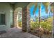 Brick paved porch with stone columns and lush tropical landscaping at 12113 Marblehead Dr, Tampa, FL 33626