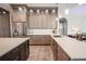 Modern kitchen with a large island, stainless steel appliances, and white quartz countertops at 12113 Marblehead Dr, Tampa, FL 33626