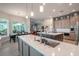 Spacious kitchen featuring modern cabinetry, stainless steel appliances, and expansive island at 12113 Marblehead Dr, Tampa, FL 33626