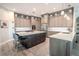Modern kitchen featuring a large island, stainless steel appliances, and contemporary cabinetry at 12113 Marblehead Dr, Tampa, FL 33626
