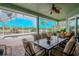 Covered lanai with patio furniture and view of the pool and golf course at 12113 Marblehead Dr, Tampa, FL 33626