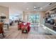 Bright living room with red sofa, wood-look floors, and access to backyard at 12113 Marblehead Dr, Tampa, FL 33626