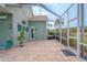 Spacious pool area with screened enclosure and paver deck at 12113 Marblehead Dr, Tampa, FL 33626