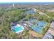 Community pool and tennis courts with surrounding landscape at 12113 Marblehead Dr, Tampa, FL 33626