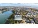 Aerial view of waterfront home community, showcasing houses and boats at 12116 Lagoon Ln, Treasure Island, FL 33706