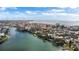 Aerial perspective of coastal neighborhood with waterfront homes and boats at 12116 Lagoon Ln, Treasure Island, FL 33706