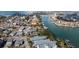 Aerial view of waterfront home and neighborhood, near the beach at 12116 Lagoon Ln, Treasure Island, FL 33706