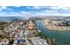 Aerial view of waterfront homes and calm waterway, showcasing a coastal area at 12116 Lagoon Ln, Treasure Island, FL 33706