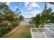 Landscaped backyard with a view of the water at 12116 Lagoon Ln, Treasure Island, FL 33706