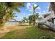 Spacious grassy backyard, offering privacy and water views at 12116 Lagoon Ln, Treasure Island, FL 33706