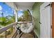Relaxing balcony with hanging chair and ocean view at 12116 Lagoon Ln, Treasure Island, FL 33706