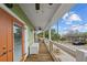 Balcony with seating area and partial ocean view at 12116 Lagoon Ln, Treasure Island, FL 33706