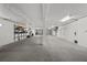 Unfinished basement garage, featuring a large double door and high ceilings at 12116 Lagoon Ln, Treasure Island, FL 33706