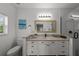 Elegant bathroom with granite vanity and walk-in shower at 12116 Lagoon Ln, Treasure Island, FL 33706