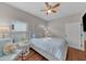 Bedroom with a bed, ceiling fan, and window coverings at 12116 Lagoon Ln, Treasure Island, FL 33706