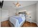 Bedroom with wood floors and ceiling fan at 12116 Lagoon Ln, Treasure Island, FL 33706