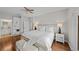 Main bedroom with king bed, hardwood floors, and ensuite bathroom access at 12116 Lagoon Ln, Treasure Island, FL 33706