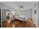 Main bedroom with king-size bed, hardwood floors and private access to bathroom at 12116 Lagoon Ln, Treasure Island, FL 33706