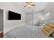 Bedroom with a bed, large TV, and ample closet space at 12116 Lagoon Ln, Treasure Island, FL 33706