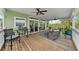 Large deck features seating, a table, and access to the interior at 12116 Lagoon Ln, Treasure Island, FL 33706