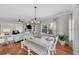 Farmhouse style dining room with hardwood floors and view of living room at 12116 Lagoon Ln, Treasure Island, FL 33706