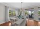 Casual dining area with white table and access to a deck overlooking water at 12116 Lagoon Ln, Treasure Island, FL 33706