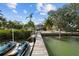 Wooden dock leading to a waterfront home at 12116 Lagoon Ln, Treasure Island, FL 33706