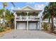 Two-story house with double garage and attractive curb appeal at 12116 Lagoon Ln, Treasure Island, FL 33706