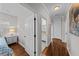 Bright hallway with hardwood floors and access to bedrooms and bathroom at 12116 Lagoon Ln, Treasure Island, FL 33706
