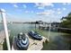 Two jet skis on a floating dock, calm water at 12116 Lagoon Ln, Treasure Island, FL 33706