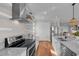 Modern kitchen featuring stainless steel appliances and granite countertops at 12116 Lagoon Ln, Treasure Island, FL 33706