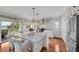 Modern kitchen with white cabinets, large island, and stainless steel appliances at 12116 Lagoon Ln, Treasure Island, FL 33706