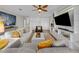 Living area with hardwood floors, comfortable seating, and built-ins at 12116 Lagoon Ln, Treasure Island, FL 33706