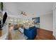 Bright living room with hardwood floors and built-in shelving at 12116 Lagoon Ln, Treasure Island, FL 33706