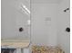 Walk-in shower with granite seat and pebble flooring at 12116 Lagoon Ln, Treasure Island, FL 33706