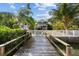Wooden walkway dock to waterfront home at 12116 Lagoon Ln, Treasure Island, FL 33706