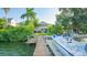 Waterfront home with private dock and boat, offering tranquil water views at 12116 Lagoon Ln, Treasure Island, FL 33706
