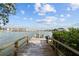 Long wooden dock extending over calm water at 12116 Lagoon Ln, Treasure Island, FL 33706