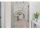 Bright and airy entryway with a view into the kitchen and living area at 12739 Rainwashed Loop, Parrish, FL 34219