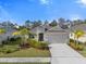 Single-Gathering home with a two-car garage and well-manicured landscaping at 12739 Rainwashed Loop, Parrish, FL 34219